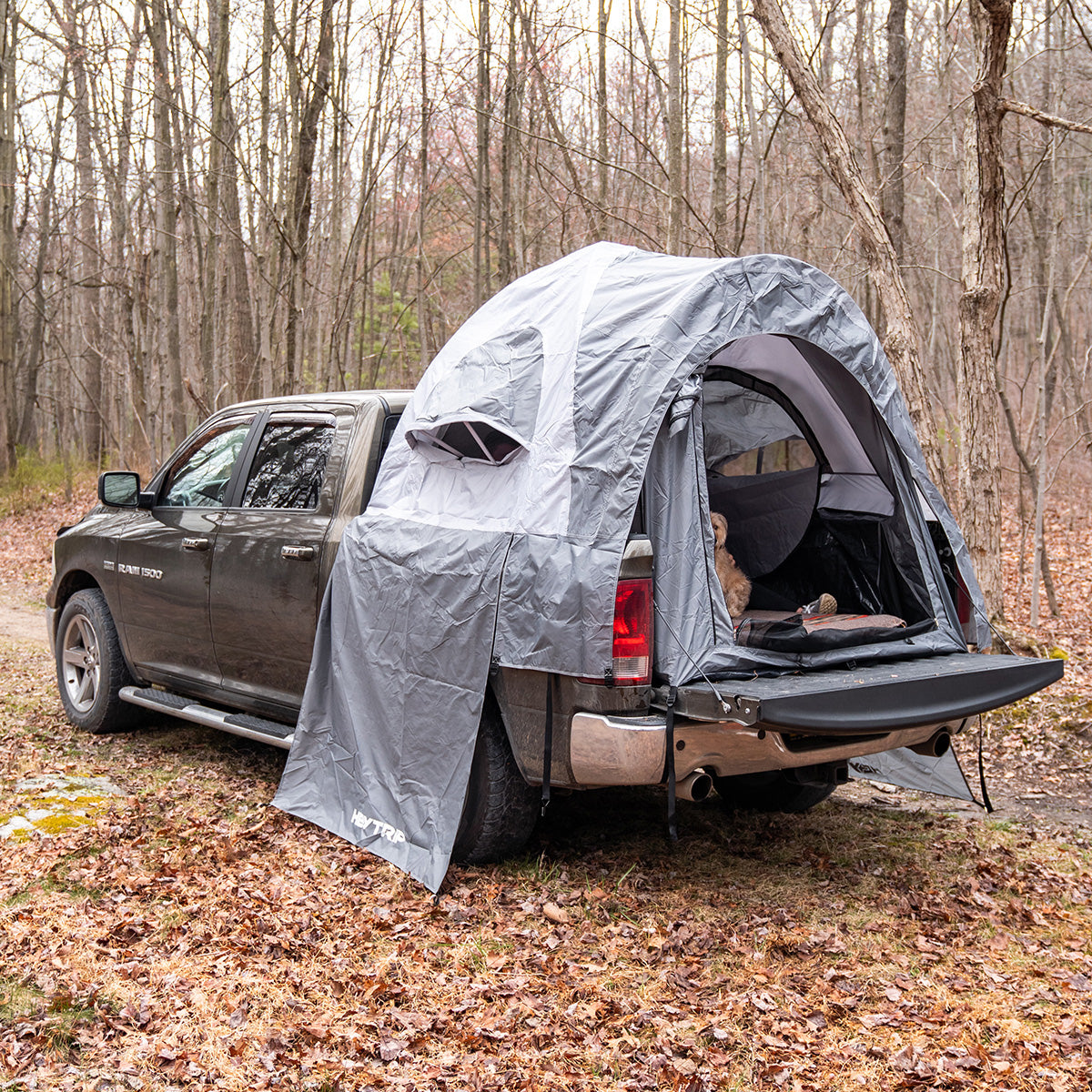 Tent over outlet truck bed